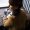 High angle view of woman sitting at table in cafe